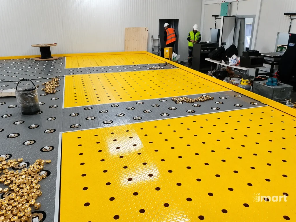 Módulos tipo CASTER en proceso de ensamble, con unidades Ball Transfer listas para instalar.